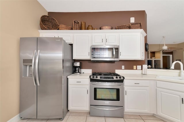 616 Misty Pond Ct, Bradenton, FL 34212 - kitchen featuring stainless steel appliances, white cabinets, light countertops, and light tile patterned flooring