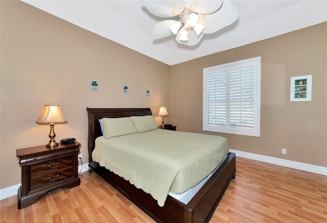 bedroom with ceiling fan and light wood-type flooring