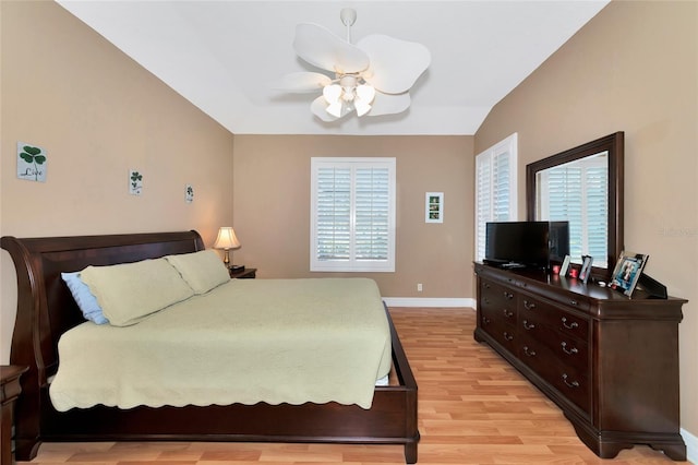 616 Misty Pond Ct, Bradenton, FL 34212 - bedroom featuring multiple windows, light wood-style floors, lofted ceiling, and a ceiling fan