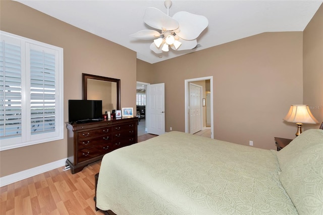 bedroom featuring vaulted ceiling, light hardwood / wood-style flooring, and ceiling fan