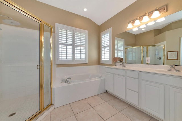 bathroom with tile patterned floors, separate shower and tub, and lofted ceiling