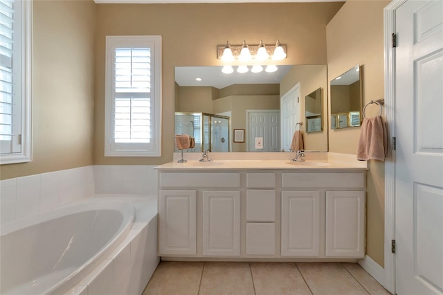 bathroom featuring tile patterned flooring, vanity, and independent shower and bath