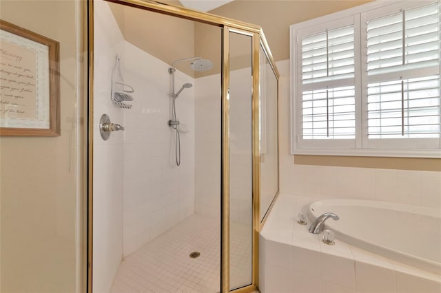 bathroom featuring independent shower and bath