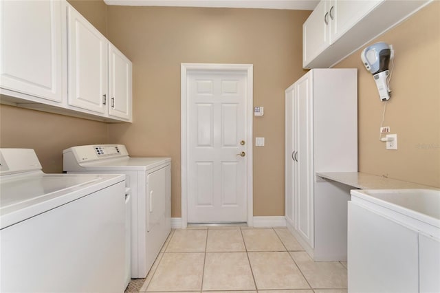 616 Misty Pond Ct, Bradenton, FL 34212 - washroom with washer and dryer, cabinet space, and light tile patterned floors