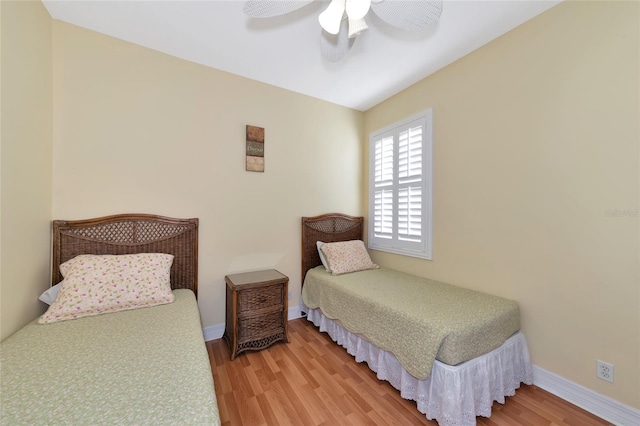 bedroom featuring wood-type flooring and ceiling fan