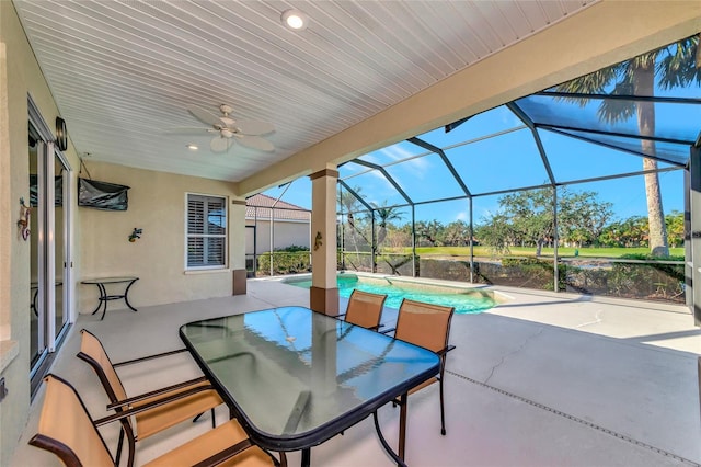 view of patio / terrace with a lanai and ceiling fan