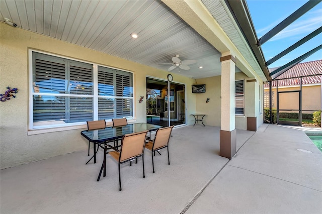 view of patio / terrace featuring ceiling fan and a lanai