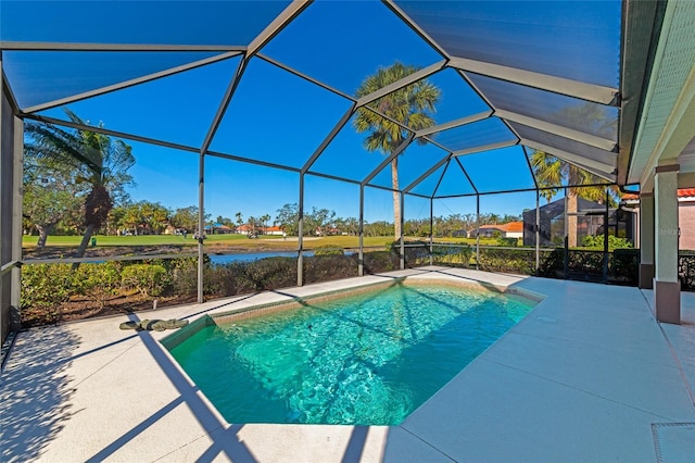 view of pool featuring glass enclosure and a patio area