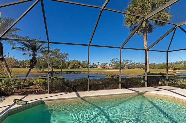 view of swimming pool with a lanai and a water view