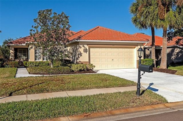 616 Misty Pond Ct, Bradenton, FL 34212 - mediterranean / spanish-style home with driveway, a garage, a tile roof, stucco siding, and a front lawn