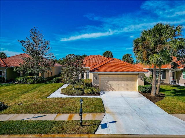 616 Misty Pond Ct, Bradenton, FL 34212 - mediterranean / spanish-style house with a tiled roof, an attached garage, driveway, and a front lawn