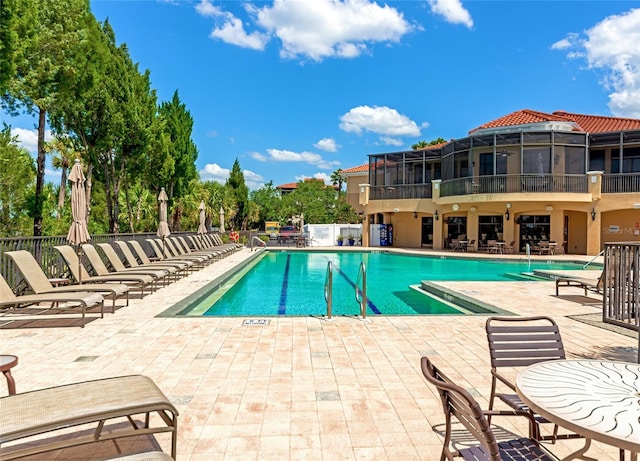 view of pool featuring a patio