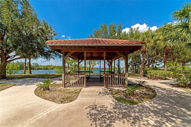 view of home's community with a gazebo and a water view