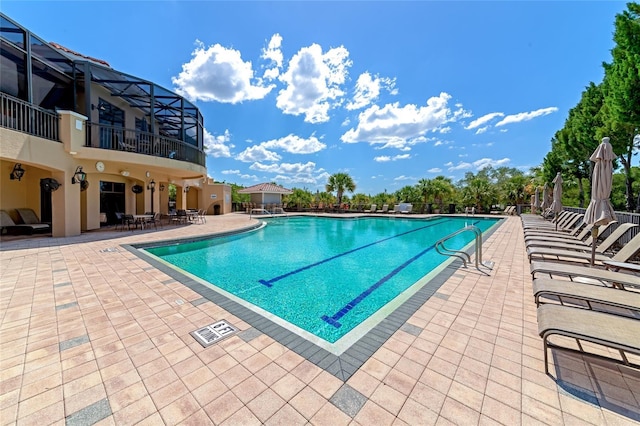 view of swimming pool featuring a patio