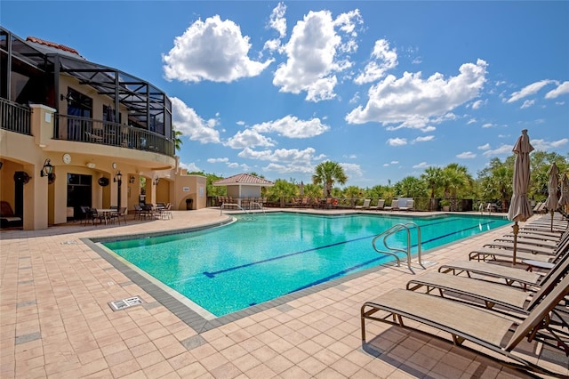 view of pool featuring a patio and a lanai