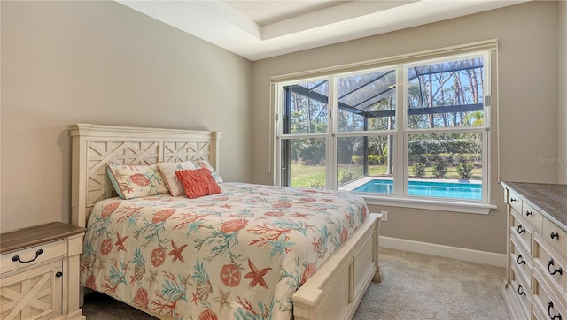 bedroom with light carpet and multiple windows