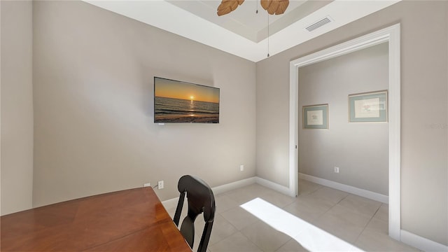 tiled home office featuring ceiling fan