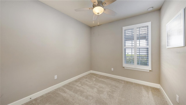 carpeted empty room with ceiling fan