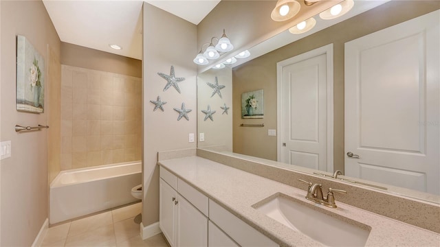 full bathroom with tile patterned flooring, vanity, toilet, and tiled shower / bath