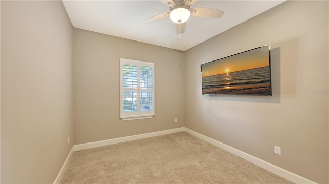 carpeted empty room with ceiling fan