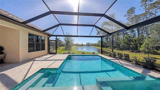 view of pool featuring glass enclosure, a patio area, and a water view