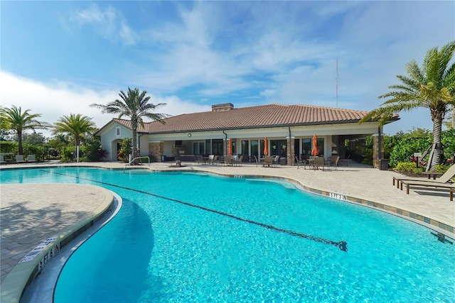 view of pool featuring a patio