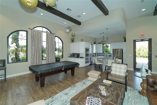 recreation room featuring beamed ceiling, dark wood-type flooring, a high ceiling, and pool table