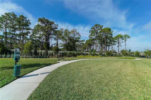 view of home's community with a lawn