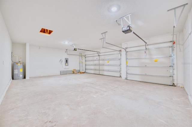 garage featuring electric panel, a garage door opener, and water heater