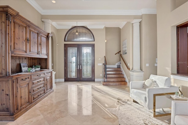 foyer with baseboards, stairs, ornate columns, and ornamental molding