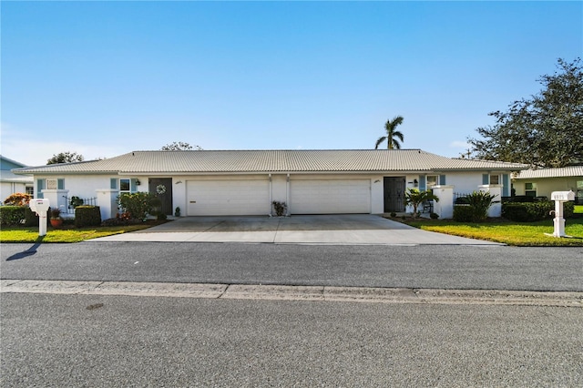 ranch-style house featuring a garage