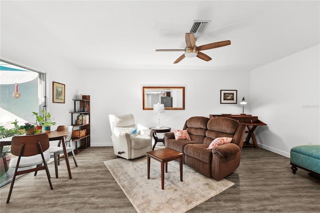 living room with ceiling fan and dark hardwood / wood-style floors