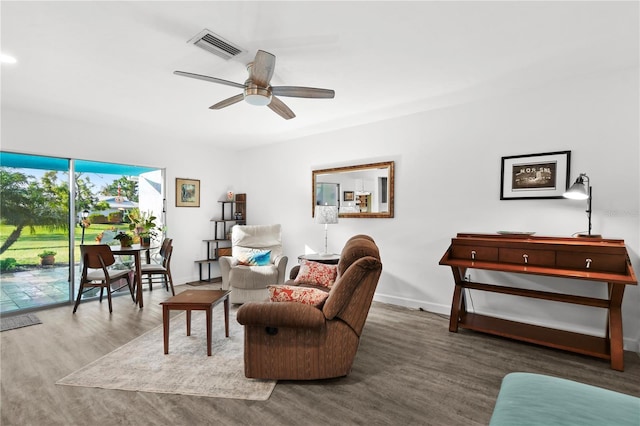 living room featuring hardwood / wood-style flooring and ceiling fan