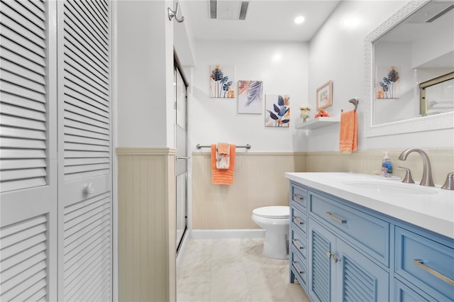 bathroom with vanity and toilet