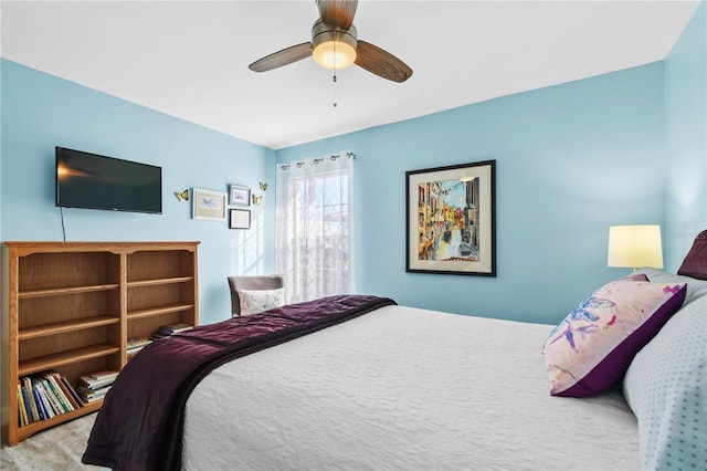 bedroom featuring ceiling fan and light colored carpet