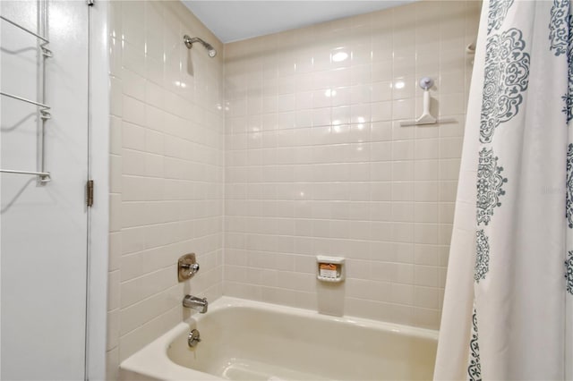 bathroom with shower / bath combination with curtain