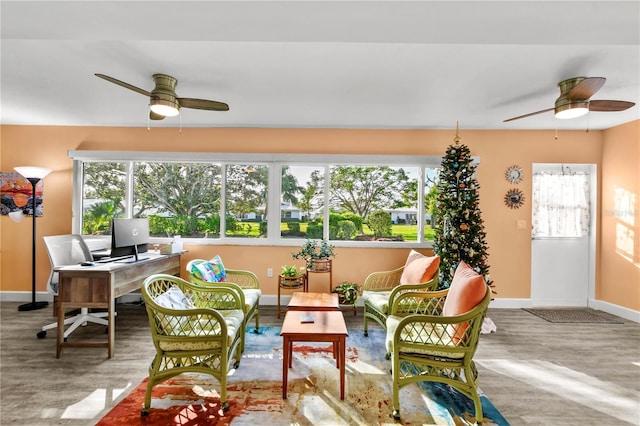 sunroom / solarium with ceiling fan and a healthy amount of sunlight