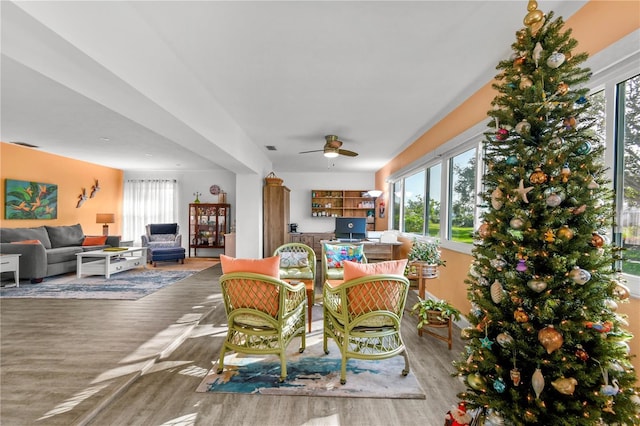 dining area featuring plenty of natural light, ceiling fan, and wood-type flooring