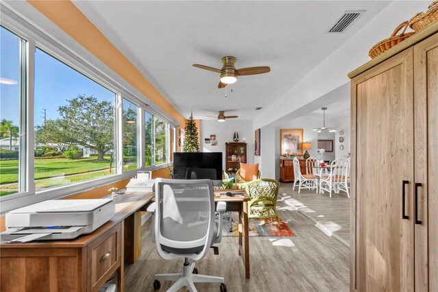 office with ceiling fan and light hardwood / wood-style floors