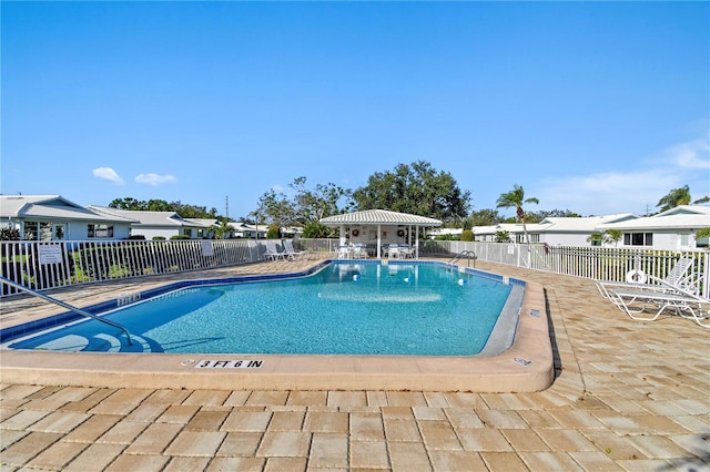 view of swimming pool featuring a patio