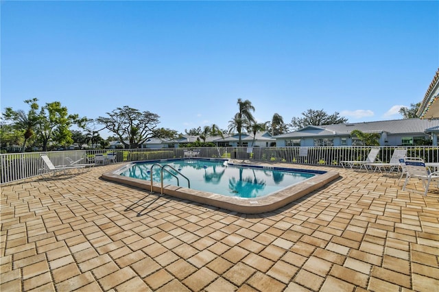 view of swimming pool featuring a patio