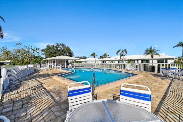 view of swimming pool featuring a patio