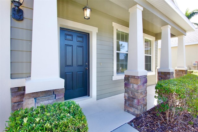 property entrance with covered porch