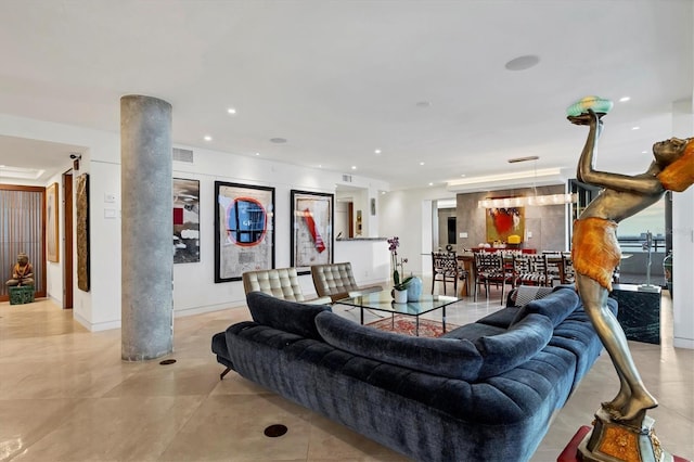 living room with decorative columns