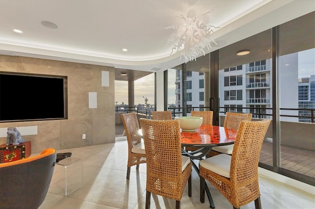 dining area with tile walls and light tile patterned floors