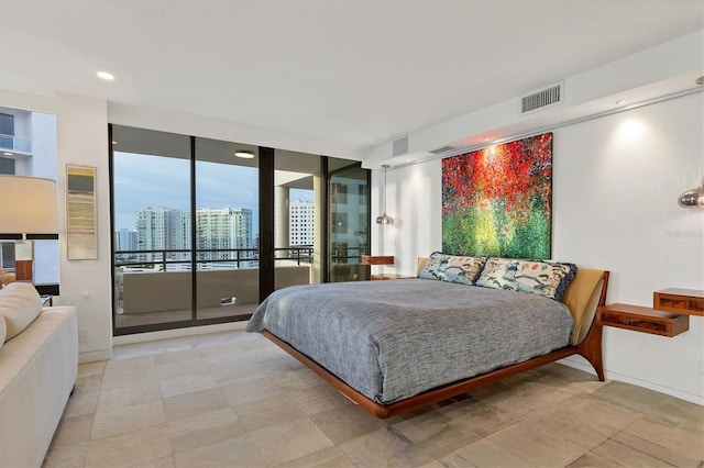 bedroom with access to exterior and floor to ceiling windows