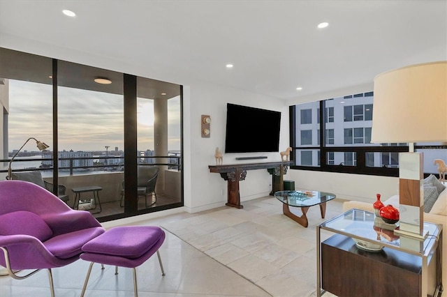 living room featuring a wall of windows