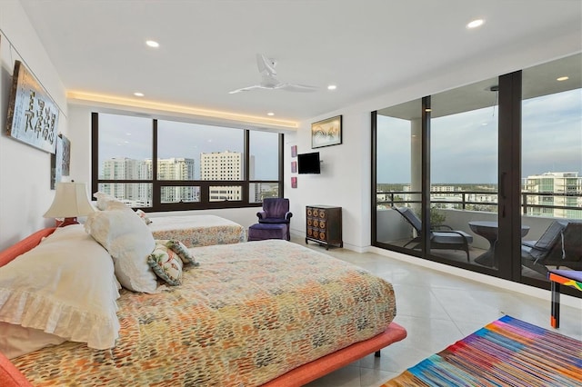 bedroom featuring floor to ceiling windows, access to exterior, and ceiling fan