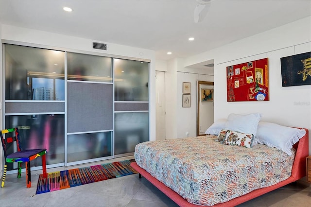 bedroom featuring tile patterned floors and a closet