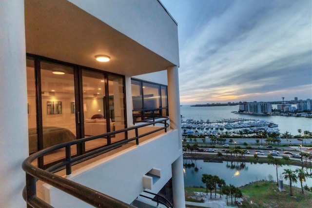 1255 N Gulfstream Ave Unit Ph1501, Sarasota, FL 34236 - balcony at dusk featuring a water view